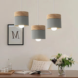 Suspension scandinave macaron cylindrique en bois et métal pour salle à manger